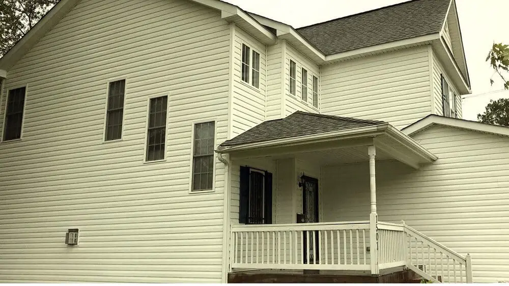 After transformation of a home’s exterior with Neilson Cleaning’s house washing, showcasing dirt and mold removal